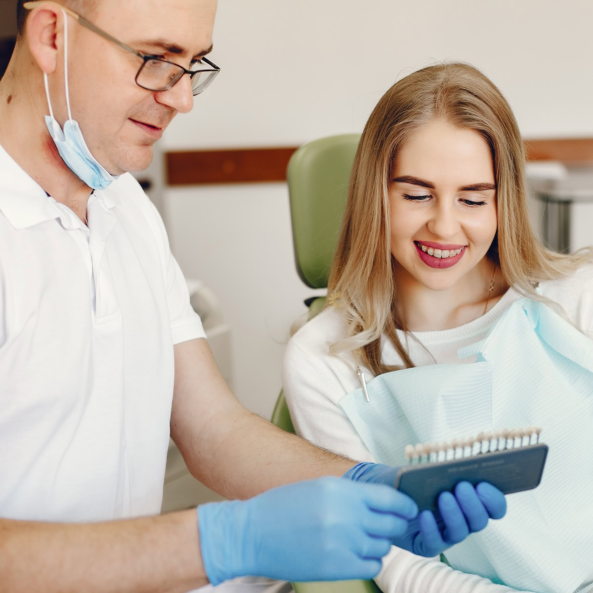 Beautiful girl sitting in the dentist's office.