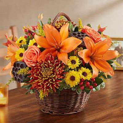 After the loss of a loved one, we find peace and comfort in every caring word and kind gesture. Offer your own thoughtful expression with our lovely basket arrangement in warm autumn colors. Beautifully designed by expert local florists, this touching tribute will help convey all the love in your heart during a difficult time.