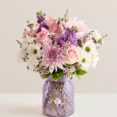 NEW Inspired by the beauty of a blooming backyard garden, our bouquet is as amazing as Mom. We arrange roses, Peruvian lilies, and other blooms in a lavender vase that accentuates the beauty of the pink petals. To really light up her day, add our LED-powered, butterfly-shape sign that declares “Amazing Mom.”