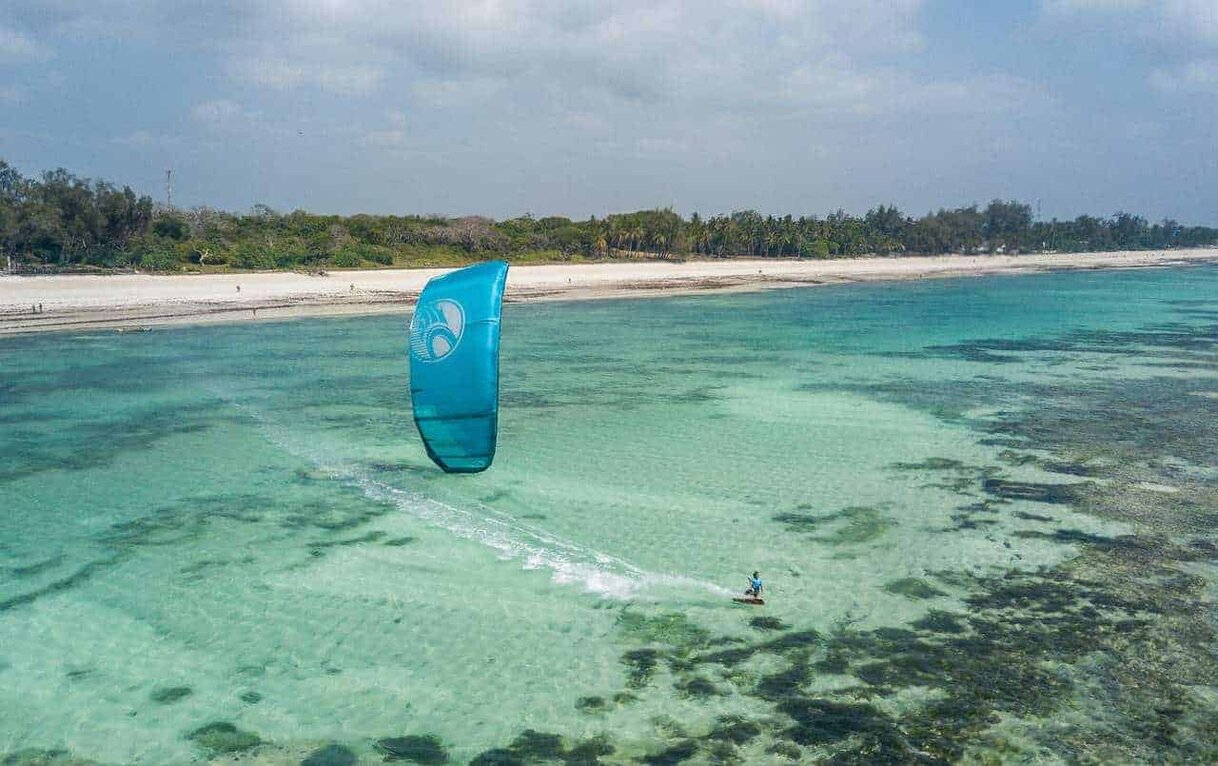 Kite surfing on turquoise waters of Diani Beach