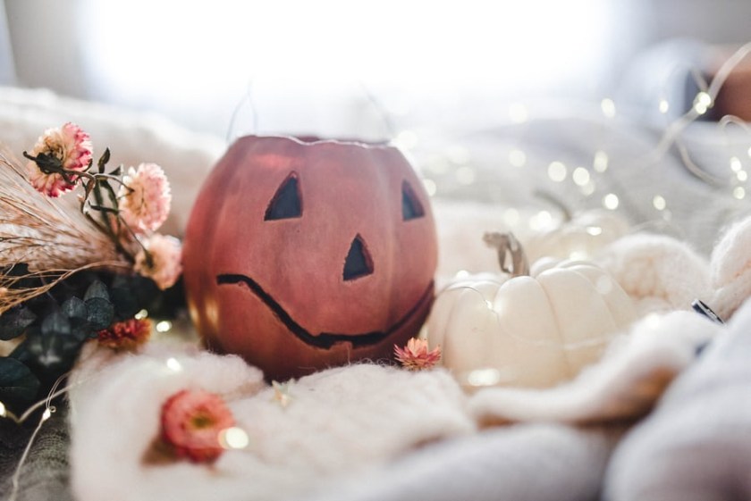 white pumpkin and cutout pumpkins for Decorating for Fall with Pumpkins