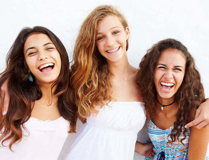 happy-teens-with-braces.webp