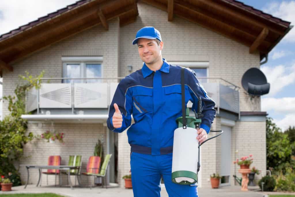 pest control worker happy and confident over a job well done, ant control 