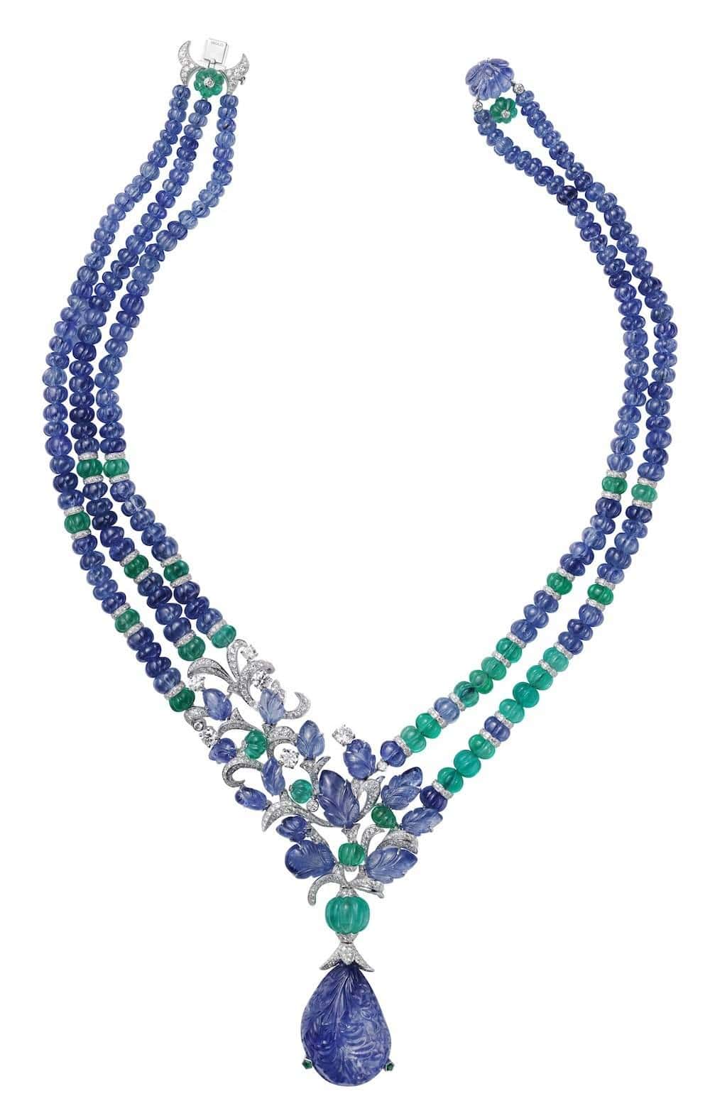 Platinum necklace with one 67.94-carat carved sapphire, melon-cut sapphire and emerald beads, sapphire carved leaves, brilliants
