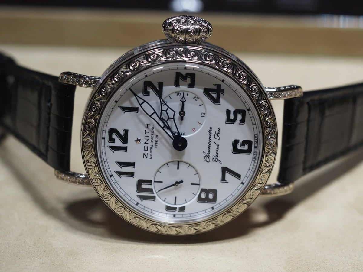 Zenith Pilot Type 20 Grand Feu in engraved white gold One of the largest, and most unusual timepieces of the year, the new Pilot Type 20 features a richly hand-engraved bezel and lugs in 18k white gold. This 60mm wide watch is the latest update of the Zenith Pilot Montre d’Aéronef Type 20, and introduces a novel sapphire crystal ring, which allows the user to see the movement inside.