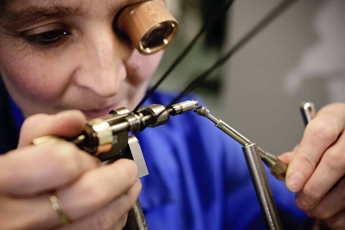 One of Glashütte Original's watchmakers bevelling edges