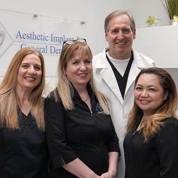 Close up shot of dentist with the dental staff inside clinic