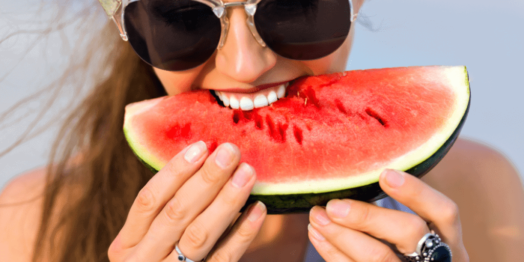 Woman eating after teeth whitening procedure