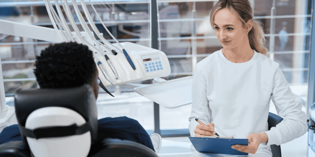 Dental professional attending to patient