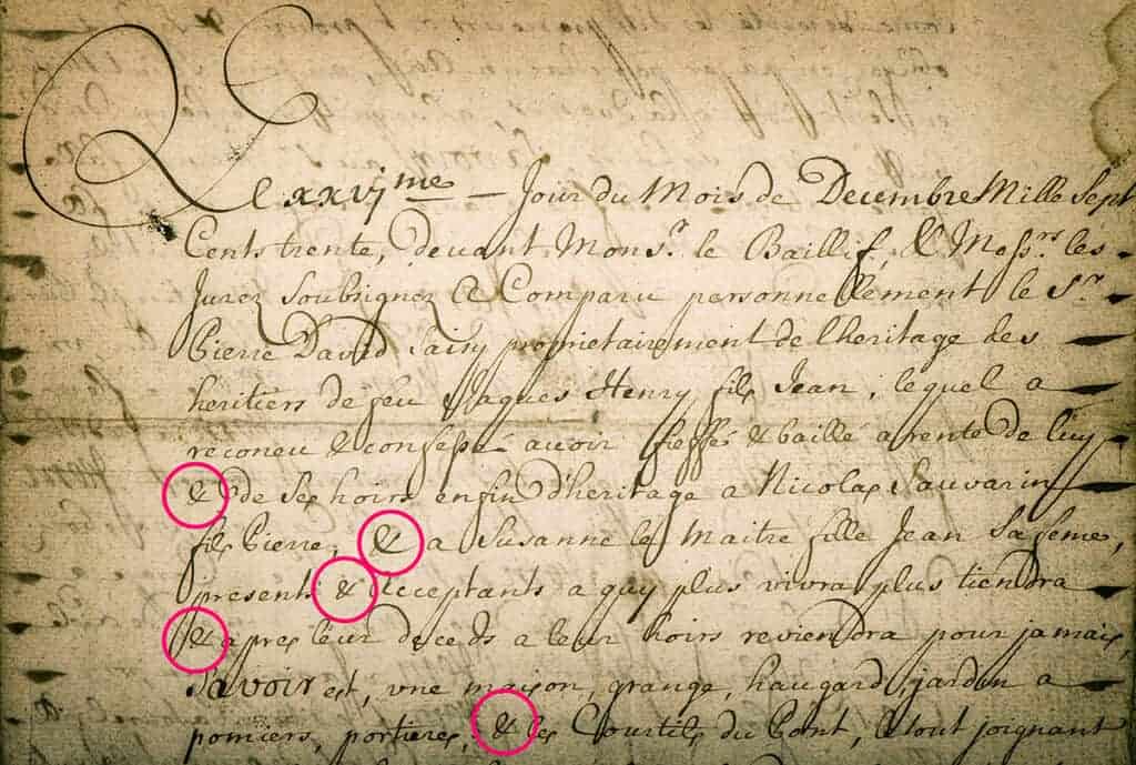 Antique handwritten manuscript with ampersands highlighted.