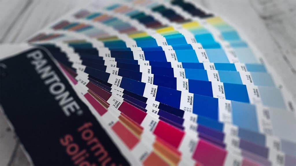 Fanned Pantone color guide focusing on a range of blue tones.