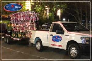 A Bell Brothers company pickup truck is pictured at night, towing a trailer filled with festively decorated bicycles. The image highlights Bell Brothers’ commitment to serving Northern California communities with professionalism and care. Customers can count on their trusted service, backed by thoroughly background-checked technicians, upfront pricing, and the No Surprise Guarantee—ensuring peace of mind from start to finish.