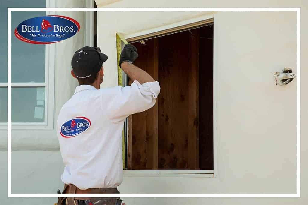 A trusted Bell Brothers technician—background-checked and uniformed—carefully measures a window frame on a bright, clean exterior, upholding our commitment to No Surprise Guarantee and clear, upfront pricing. Bell Brothers is proud to serve Northern California communities with the reliability and outstanding service our reputation is built on.