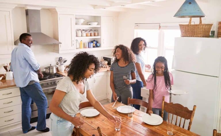 A happy family prepares a meal together in their sunlit kitchen—while one man cooks at the stove, four women and girls set the table and enjoy conversation. Bell Brothers is proud to help keep moments like these comfortable and worry-free, thanks to our trusted background-checked technicians, upfront pricing, and our No Surprise Guarantee. It’s why families across Northern California rely on us for honest service they can count on.