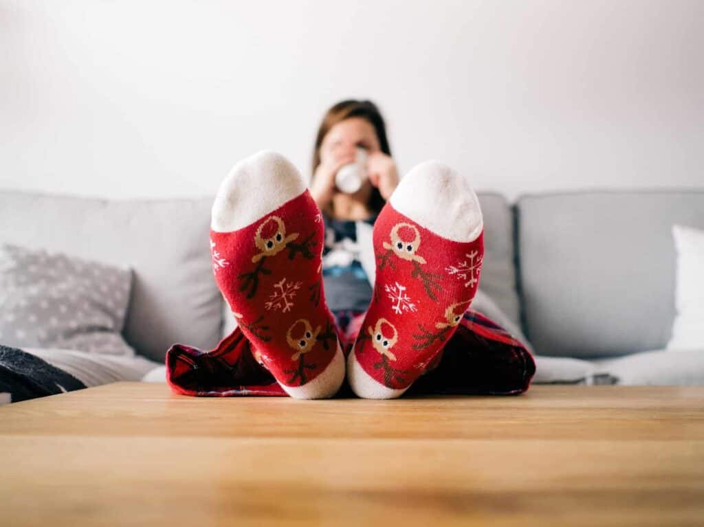 Enjoying peace of mind this season, a person relaxes comfortably at home, knowing Bell Brothers’ background-checked technicians deliver trusted service. With our renowned No Surprise Guarantee and clear, upfront pricing, homeowners across Northern California count on us for worry-free comfort from a team they can trust.