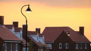 Suburban rooftops and street lamps glow beneath a warm yellow-orange sunset, reflecting Bell Brothers’ trusted service lighting up Northern California neighborhoods. Our background-checked technicians provide expert care with upfront pricing and our No Surprise Guarantee, earning us the reputation for reliability you can count on in every community we serve.