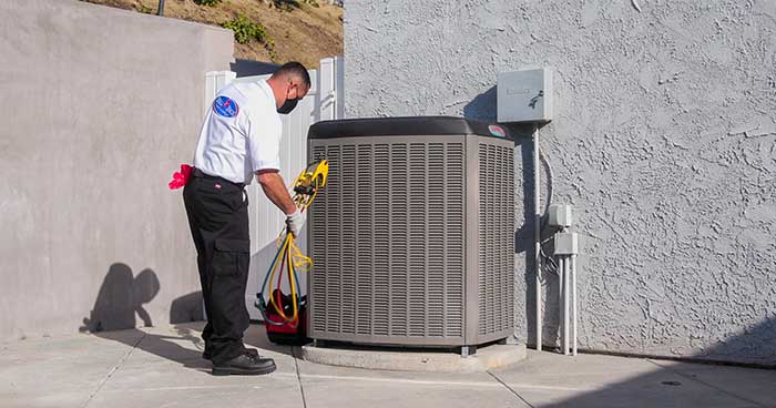 Bell Brothers tech conducting an AC tune-up
