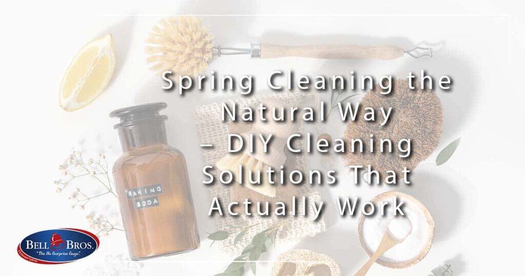 A wooden scrub brush, a lemon half, a glass jar of baking soda, and natural cleaning sponges are arranged on a white background. Text highlights DIY natural spring cleaning solutions alongside Bell Brothers’ trusted service throughout Northern California—featuring our No Surprise Guarantee, background-checked technicians, and honest upfront pricing for your peace of mind.
