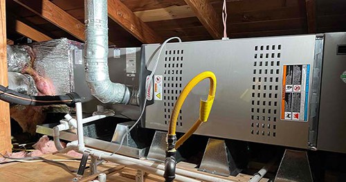 Image: a furnace in an attic. 