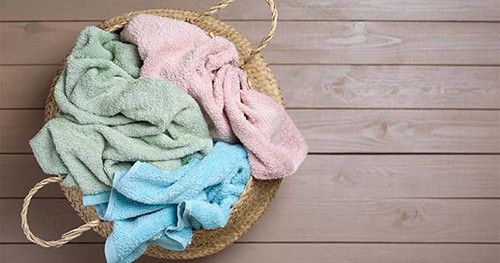 Image: a basket full of dirty gym towels.