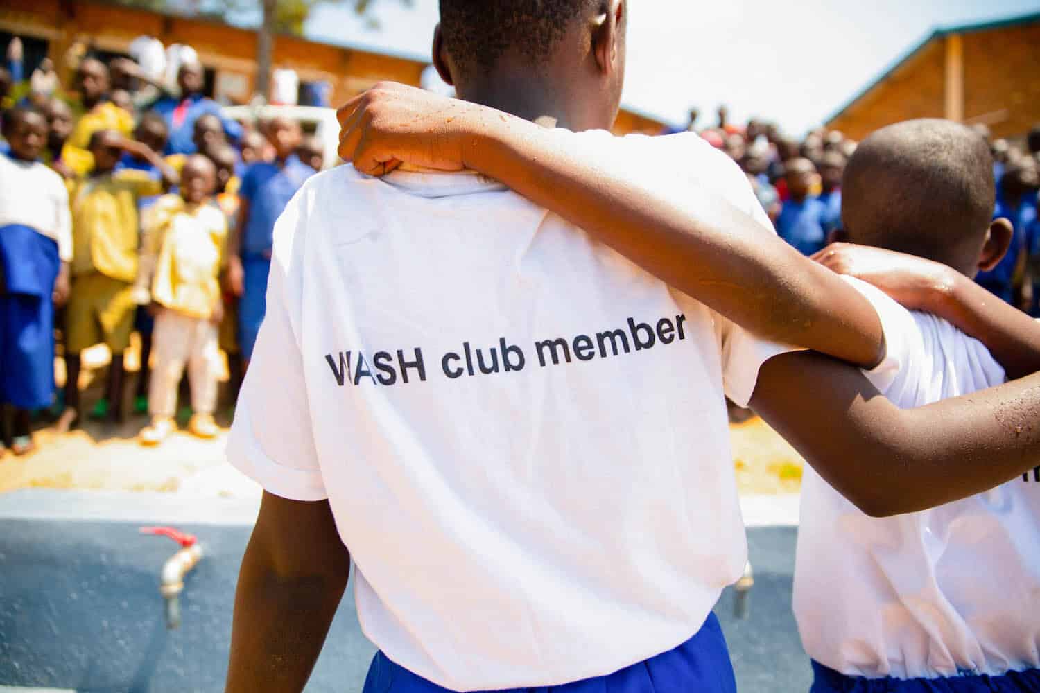 schoolchild wearing a wash club member t-shirt