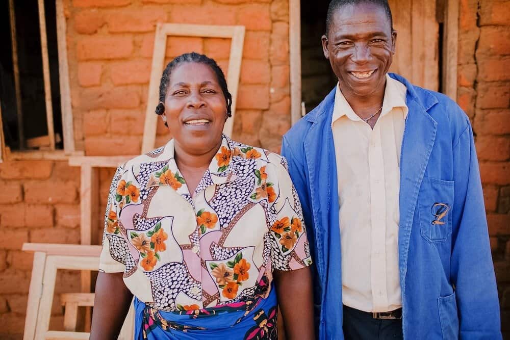 malawian couple smiles at camera
