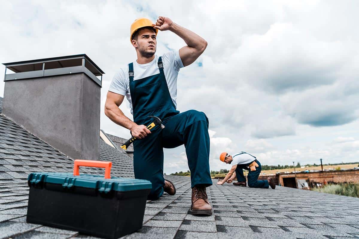 selective focus of handsome handyman touching helm resize.jpg