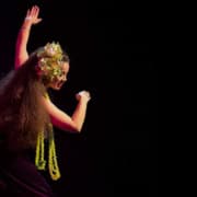 Image of Edie Stanley performing Hawaiian dance on stage