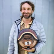 Image of Max Berry holding an mbira