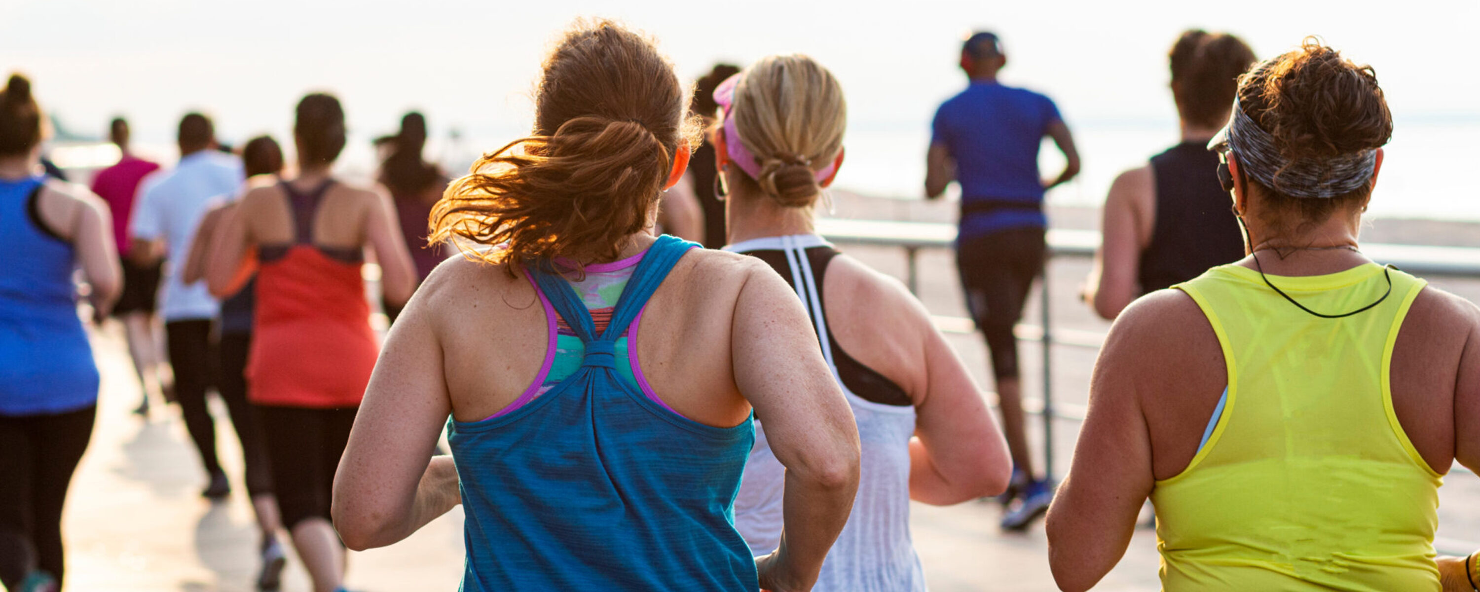a group of women jog together outside