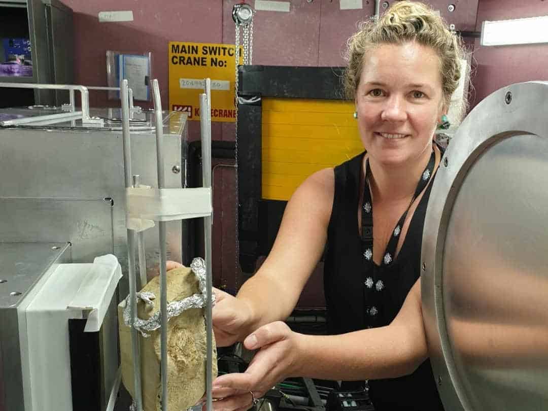 Dr-alice-clement-with-fish-fossil