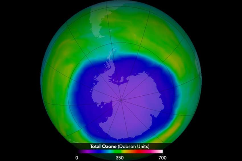 View of earth focussed on antarctica with dobson units showing ozone depletion across antarctica