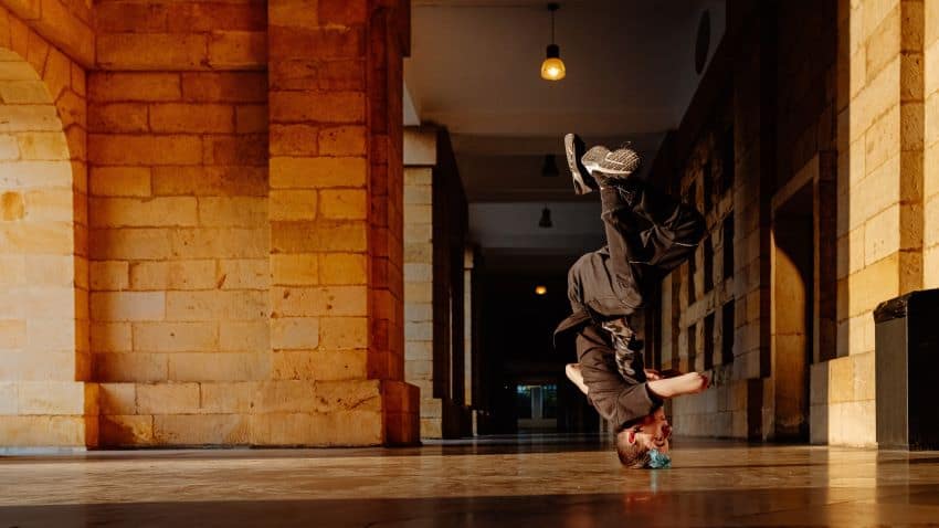 Person breakdancing in head spin