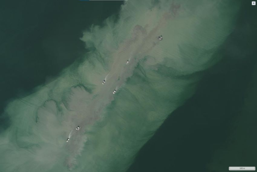 Aerial shot of trawlers disturbing seabed