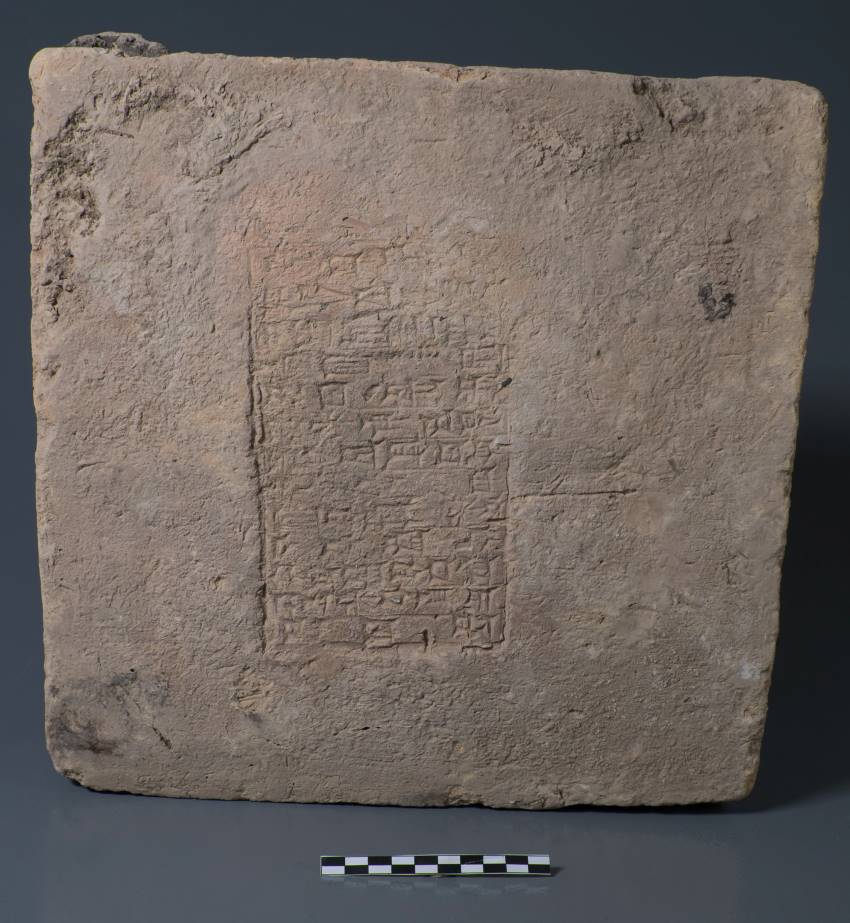 Brick with mesopotamian inscription on the front
