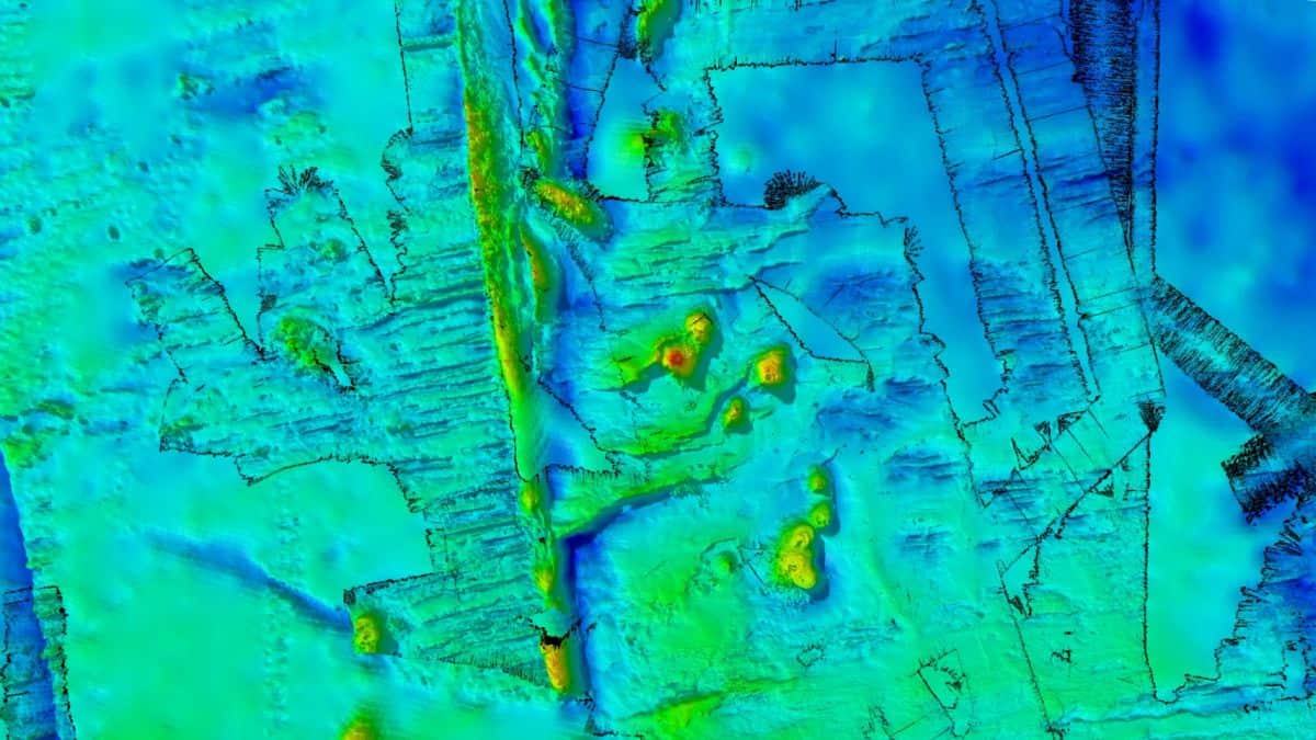 Blue and yellow 3d image of survey area with newly mapped seafloor features.