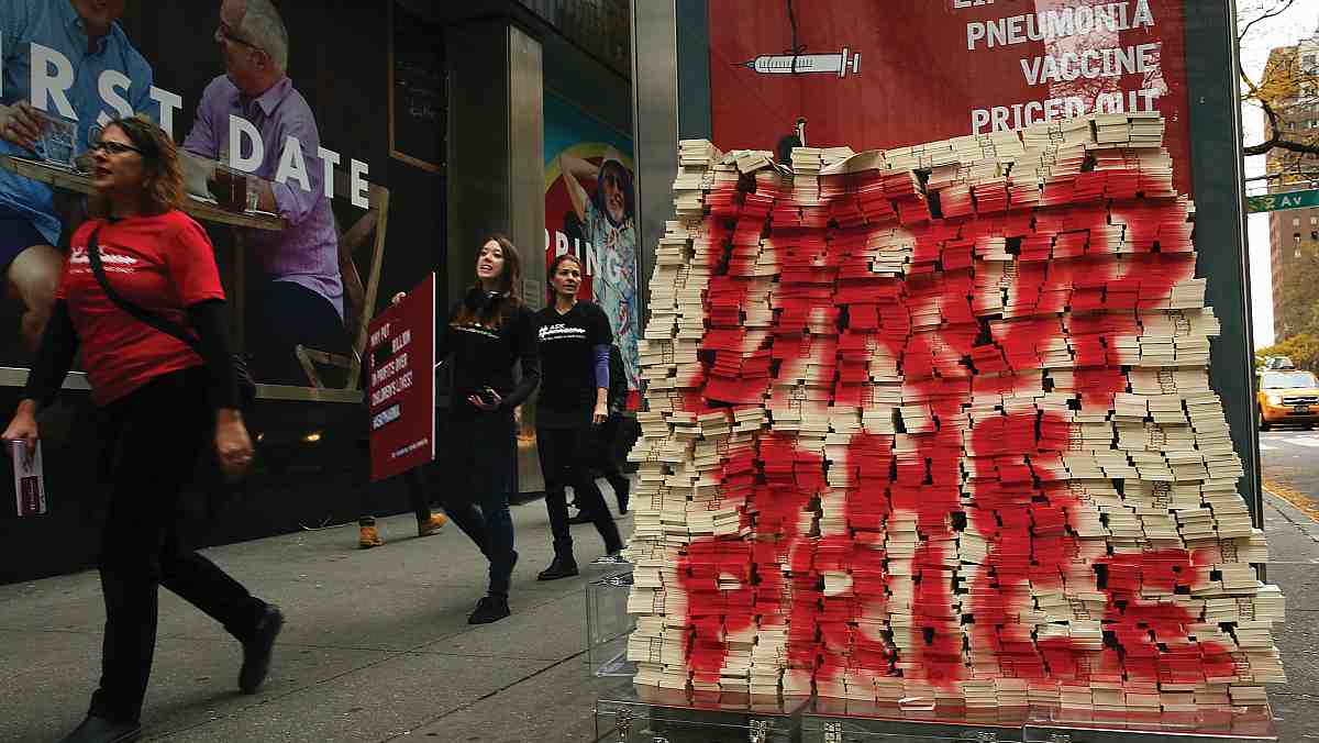 Fake notes stacked up outside the building of pharmaceutical giant pfizer.