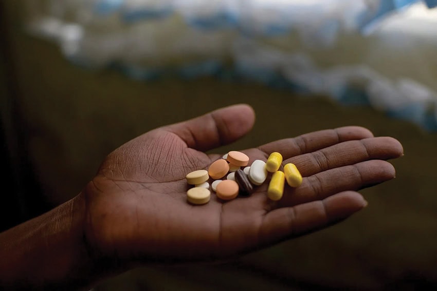 A woman displays her daily xdr-tb oral dose.