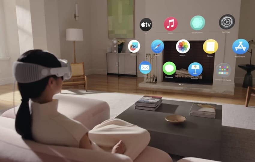 Person sits on couch watching apps float in augmented reality