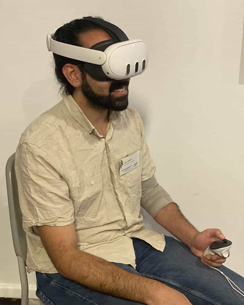 Dashing young journalist wearing a vr headset