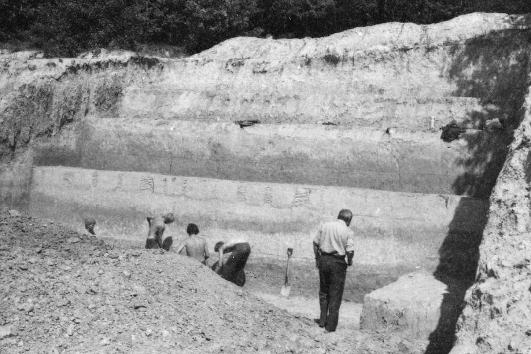 Black and white photograph from 1980s of an archaeological site dig