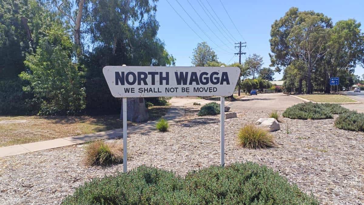 A suburban welcome sign reads "north wagga we shall not be moved"
