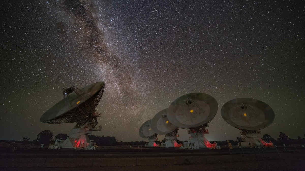 Telescope dishes under stars milky way night sky