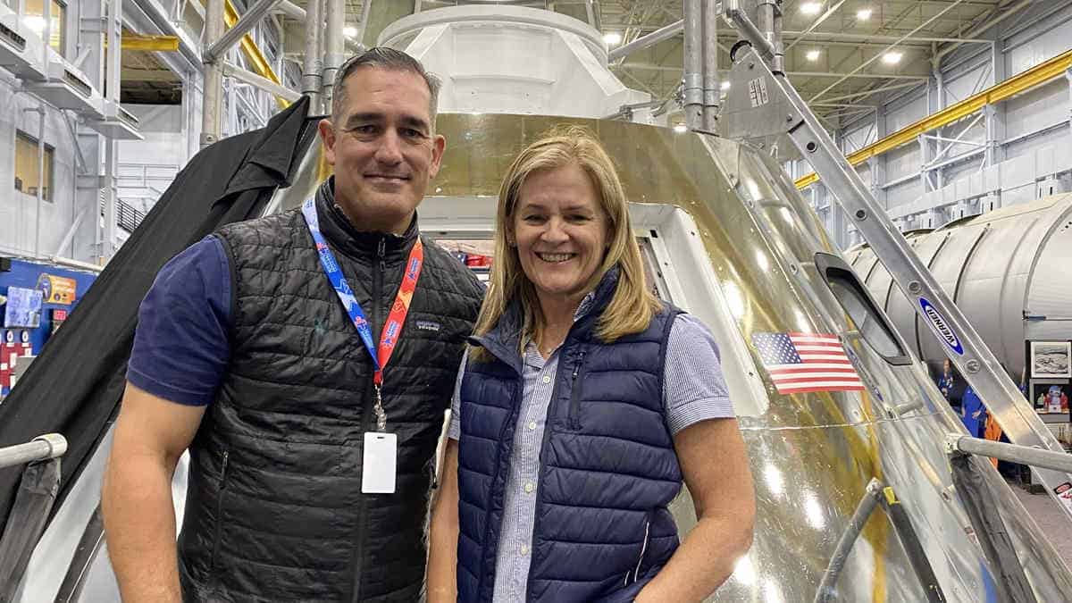 Scientists in front of nasa capsule