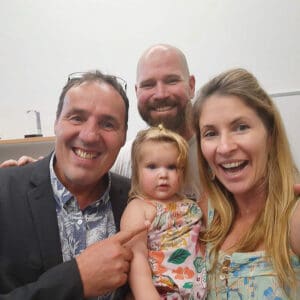 Two men, a woman and child.