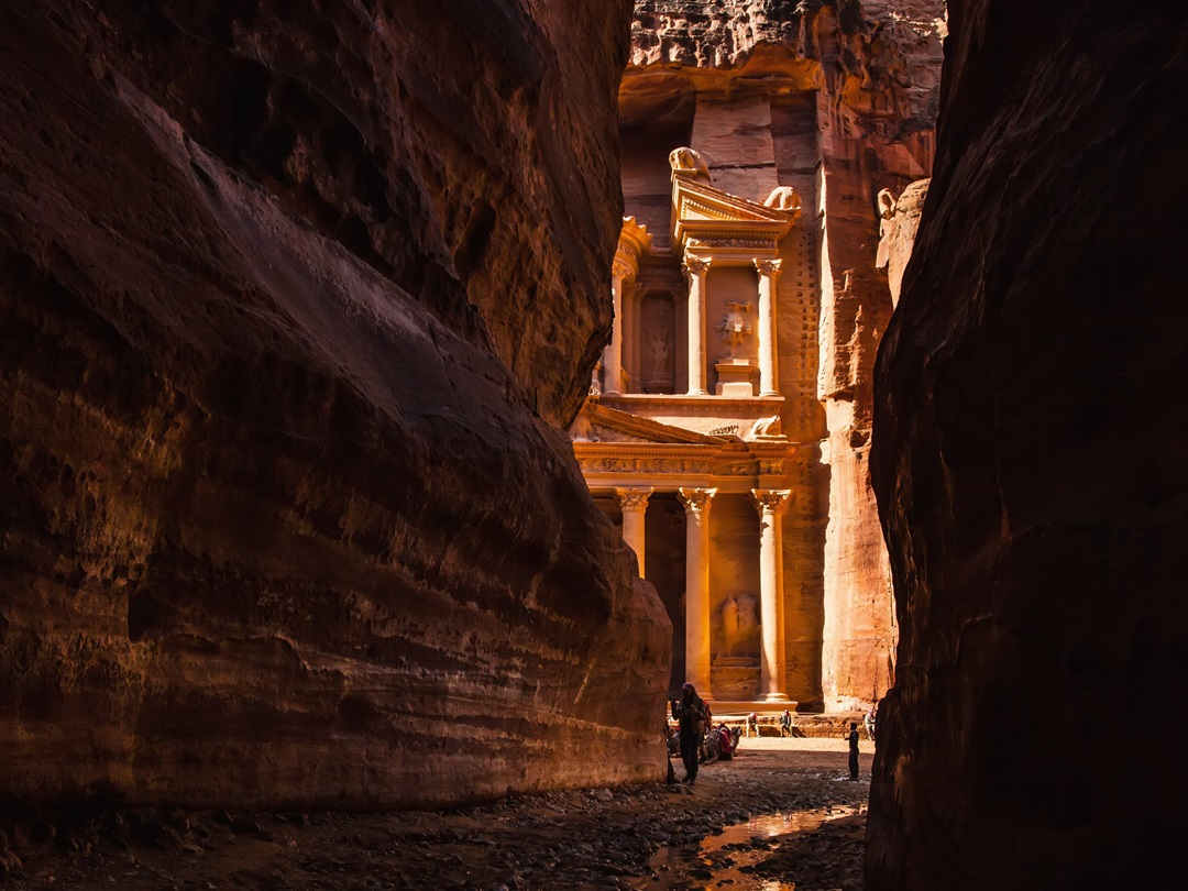 Jordan, el khazneh seen from natural narrow canyon; petra