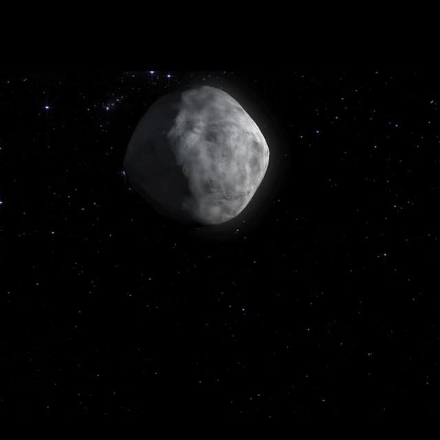 An image of a white asteroid in space, bennu.