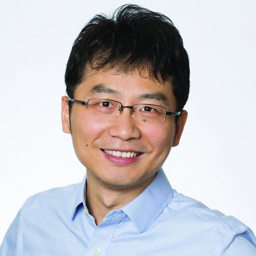 Man wearing glasses and blue shirt.