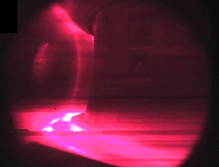 Pink plasma in a tokamak doughnut machine