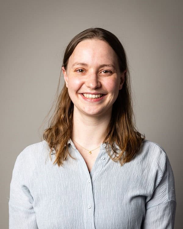 Woman scientist in grey shirt